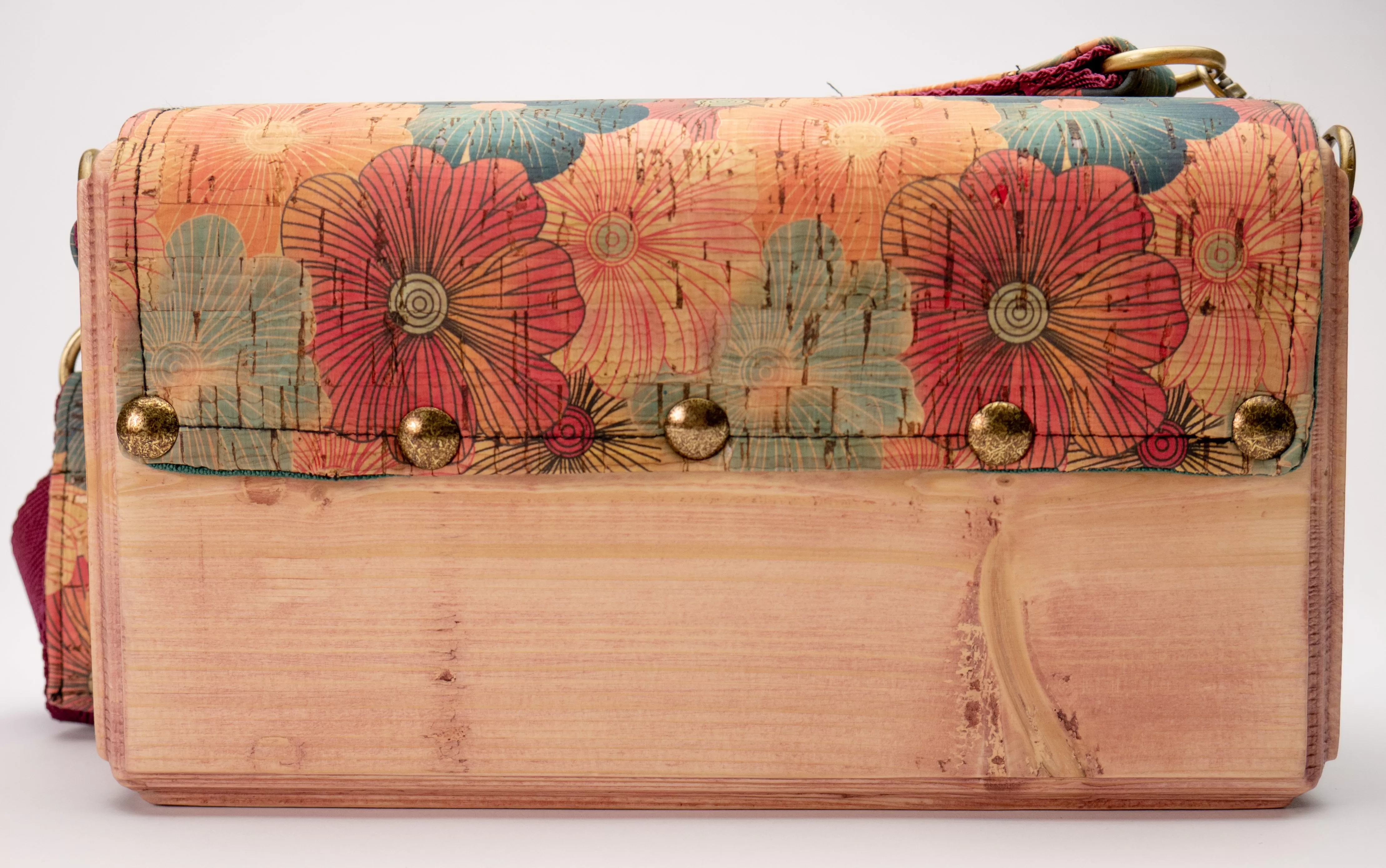 An Eco-Friendly wooden handmade crossbody bag with flower pattern cork leather.